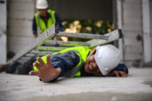 A ladder crushing a construction worker, depicting falling objects.
