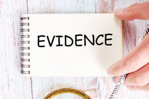 A notebook with 'evidence' written across it.