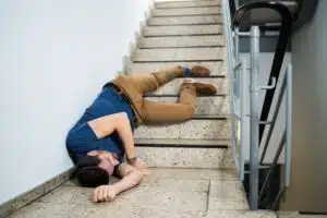 A man in need of medical treatment after falling down some stairs