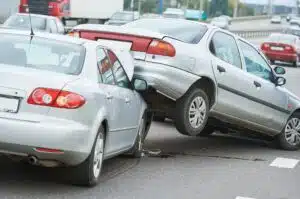 A car has crashed into the back of another car. 